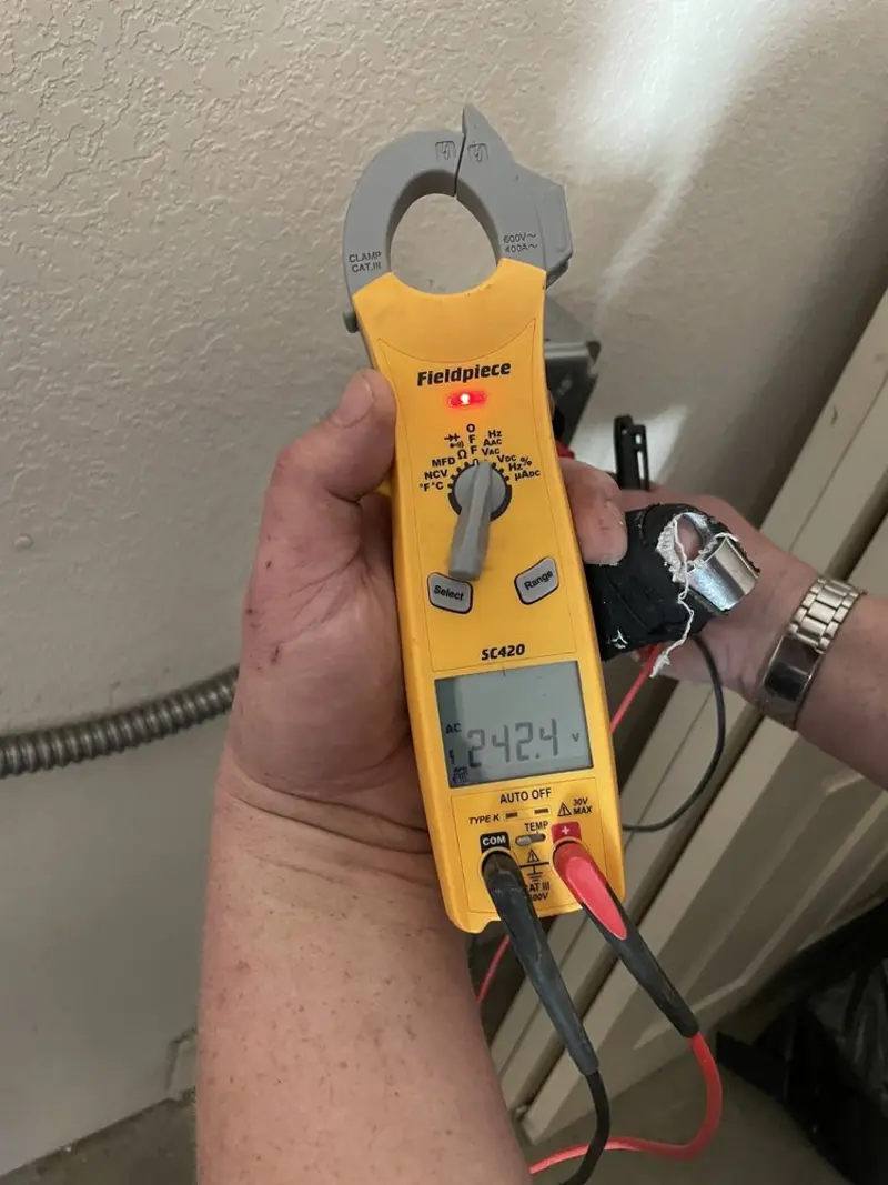 Voltage testing with clamp meter during Circuit Breaker Repair in Detroit